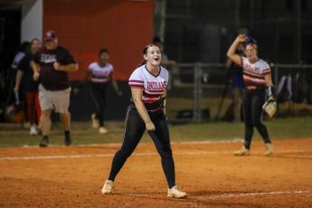 Fort White pitcher Kadence Compton celebrates after finishing her complete-game victory over Madison County on Thursday in the Region 3-1A semifinals.