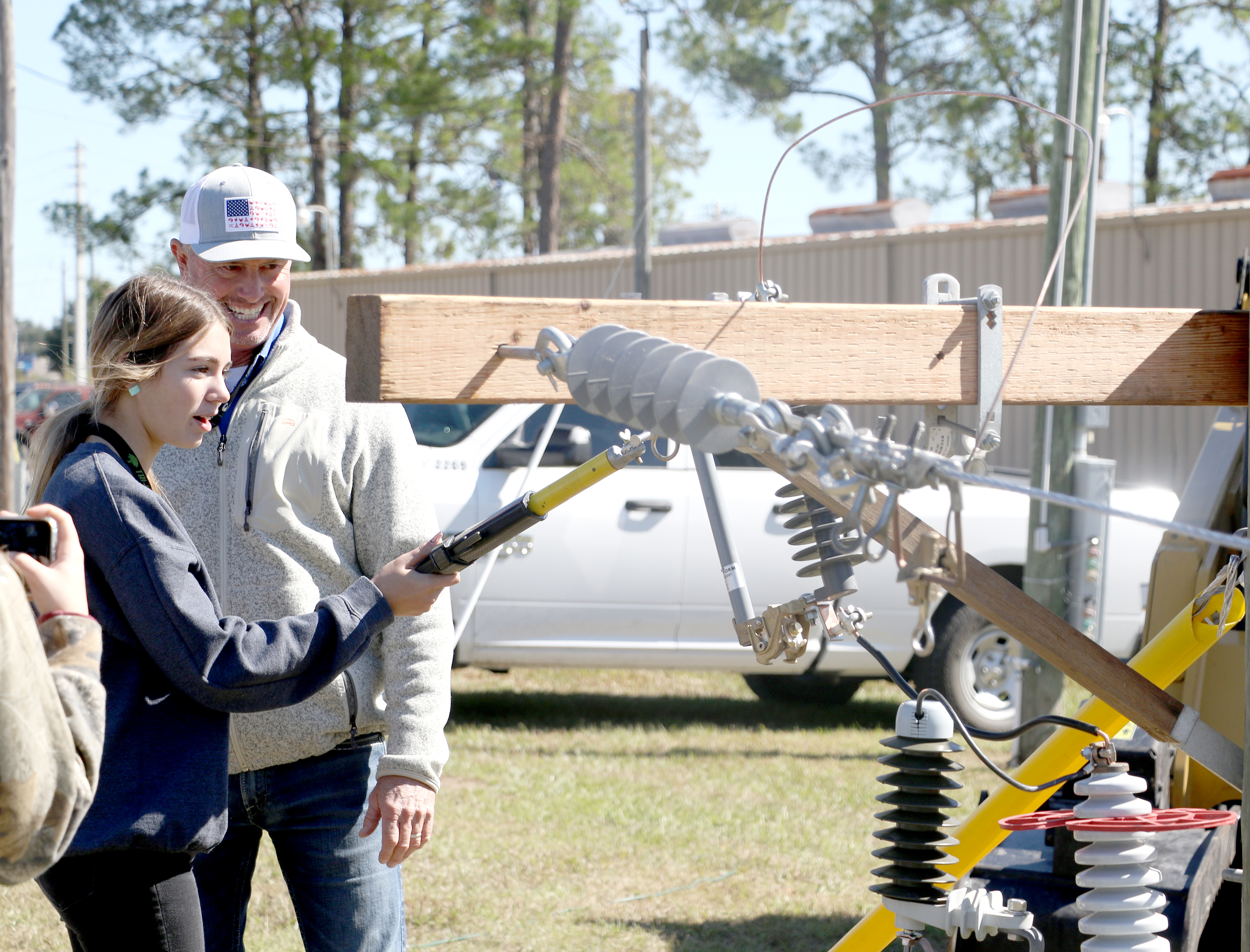 An area high school student tries her hand on working with electric lines at the Clay Electric Cooperative booth at the 2022 Build My Future event. This year’s event is Wednesday at the Florida Gateway Fairgrounds. (FILE)