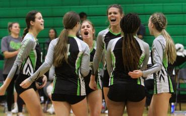 Suwannee celebrates a point against Columbia on Wednesday. (PAUL BUCHANAN/Special to the Reporter)