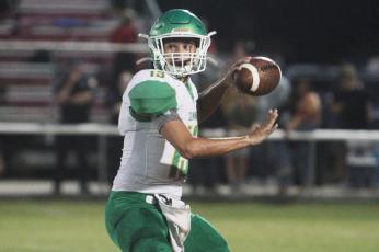 Suwannee quarterback Bronsen Tillotson gets set to throw a pass against Dixie County on Aug. 27. (PAUL BUCHANAN/Special to the Reporter)