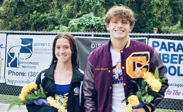 Columbia swimmers Nevaeh Ross (left) and Jayden Drew (right) were recognized on Senior Night during Thursday’s meet against Suwannee. (COURTESY)