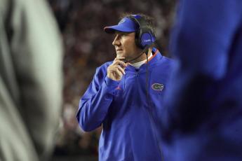 Florida head coach Dan Mullen watches from the sideline during the a game against South Carolina on Nov. 6 in Columbia, S.C. (SEAN RAYFORD/Associated Press)