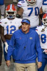 Florida head coach Dan Mullen walks with his team to the field prior to Saturday’s game against Missouri in Columbia, Mo. (L.G. PATTERSON/Associated Press)