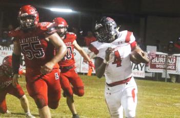 Fort White running back Maliki Clark rushes up the field against Lafayette during Friday’s Region 3-1A quarterfinal. (MORGAN MCMULLEN/Lake City Reporter)