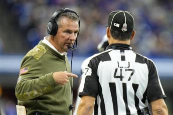 Jacksonville Jaguars head coach Urban Meyer talks with line judge Tim Podraza during Sunday's game against the Indianapolis Colts in Indianapolis. (AJ MAST/Associated Press)