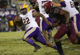 Columbia running back Tony Fulton runs up the field against Raines on Oct. 28. (BRENT KUYKENDALL/Lake City Reporter)