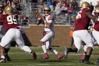Florida State quarterback Jordan Travis looks to pass during Saturday's game against Boston College in Boston. (MARY SCHWALM/Associated Press)