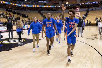 Florida's Niels Lane, right, celebrates as he walks off the court after beating Missouri 66-65 on Wednesday in Columbia, Mo. (L.G. PATTERSON/Associated Press)