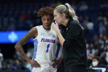 Florida head coach Kelly Rae Finley talks with Kiara Smith during a game against Vanderbilt at the women's Southeastern Conference tournament on March 3 in Nashville, Tenn. (MARK HUMPHREY/Associated Press)