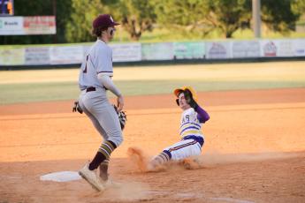 Columbia’s Matt Dumas slides safely into third base during Monday’s game against St. Augustine. (BRENT KUYKENDALL/Lake City Reporter_