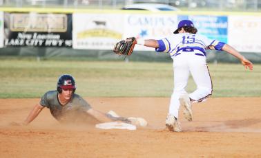 Columbia shortstop Truitt Todd misses the tag on Chiles shortstop Grant Gallagher as he steals second base on Wednesday. ( JORDAN KROEGER/Lake City Reporter)