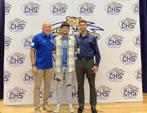 Trinity Baptist coach Dan Robertson (left) stands with Noel Caballero and Caballero’s travel soccer coach Jared Albury during Thursday’s signing ceremony. (COURTESY)