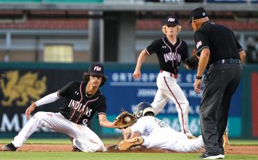Fort White shortstop Daniel Gonzalez (left) is late in applying a tag to a Holmes County runner at second base during Wednesday’s Class 1A state semifinal at Hammond Stadium in Fort Myers. (CHRIS TILLEY/Special to the Reporter)