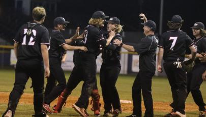 Fort White players celebrate after defeating Union County in the Region 3-1A semifinals on Tuesday. (MORGAN MCMULLEN/Lake City Reporter)