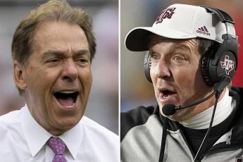 Alabama head coach Nick Saban (left) yells to the sideline during a scrimmage, on April 16 in Tuscaloosa, Ala. Texas A&M coach Jimbo Fisher  (right) reacts to an official's call during a game against Mississippi on Nov. 13, 2021, in Oxford, Miss. (AP FILE)