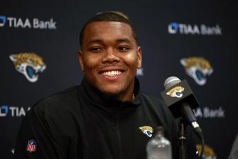 Travon Walker, the Jacksonville Jaguars first round pick and No. 1 overall in the NFL draft, smiles during a press conference on April 29 at TIAA Bank Field in Jacksonville. (COREY PERRINE/The Florida Times-Union via AP)