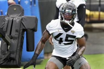 Jacksonville Jaguars defensive lineman K'Lavon Chaisson performs a drill during Tuesday's practice in Jacksonville. (JOHN RAOUX/Associated Press)