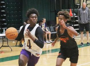 Columbia forward Ty’jahn Wright drives to the basket against Orange Park during summer league play on Thursday at FGC. (JORDAN KROEGER/Lake City Reporter)