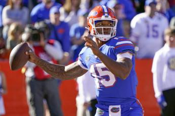 Florida quarterback Anthony Richardson looks for a receiver against Florida State on Nov. 27, 2021, in Gainesville. (JOHN RAOUX/Associated Press)