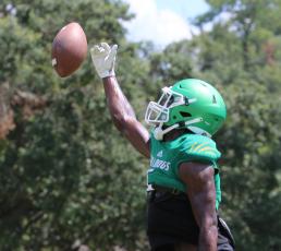 Suwannee defensive back Jay Smith knocks the ball away during a drill at practice on Aug. 4. (JAMIE WACHTER/Lake City Reporter)
