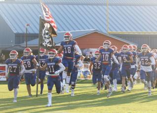 Branford’s football team heads out on to the field for last Friday’s Preseason Classic against Fort White. (MORGAN MCMULLEN/Lake City Reporter)