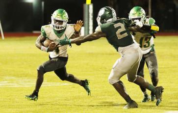 Suwannee running back Marquavious Owens tries to escape a tackle against Flagler Palm Coast last Friday. (JAMIE WACHTER/Lake City Reporter)