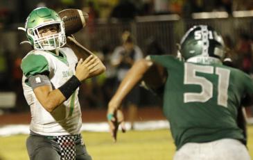 Suwannee quarterback Bronsen Tillotson sets to throw a pass against Flagler Palm Coast on Friday night. (JAMIE WACHTER/Lake City Reporter)