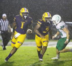 Columbia quarterback Tyler Jefferson rushes on a QB keeper against DeLand on Friday. (BRENT KUYKENDALL/Lake City Reporter)