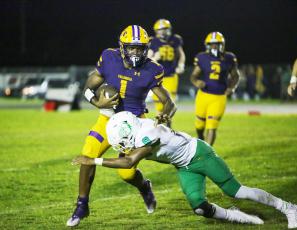 Columbia quarterback Tyler Jefferson is tackled by a DeLand defender during Friday’s game. (BRENT KUYKENDALL/Lake City Reporter)