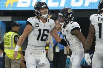 Jacksonville Jaguars quarterback Trevor Lawrence (16) and wide receiver Marvin Jones Jr. celebrate after connecting on a touchdown pass during Sunday’s game the Los Angeles Chargers in Inglewood, Calif. (MARCIO JOSE SANCHEZ/Associated Press)