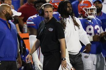 Florida head coach Billy Napier paces the sideline during last Saturday's game against South Florida in Gainesville. (JOHN RAOUX/Associated Press)