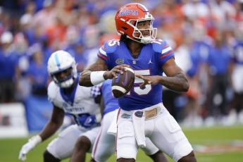 Florida quarterback Anthony Richardson throws a pass against Kentucky on Saturday in Gainesville. (JOHN RAOUX/Associated Press)
