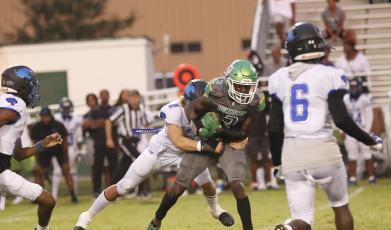 Suwannee receiver Jays Smith is tackled after a catch against Wildwood on Friday. (JAMIE WACHTER/Lake City Reporter)