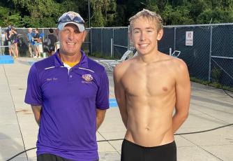 Columbia swimmer Ian Disosway (right) broke the school record in the 100 breaststroke during Thursday’s meet against Baker County. Disosway is pictured with Columbia head coach Shawn Rost. (COURTESY)