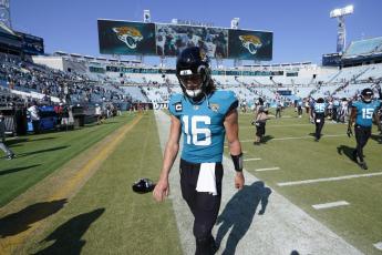 Jacksonville Jaguars quarterback Trevor Lawrence walks off the field after losing 13-6 to the Houston Texans on Sunday in Jacksonville. (JOHN RAOUX/Associated Press)