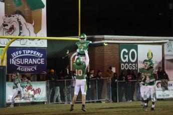 Suwannee wide receiver Kodi Lang lifts teammate Jay Smith into the air after Smith caught the go-ahead touchdown in the fourth quarter Friday night against West Florida. (PAUL BUCHANAN/Special to the Reporter)