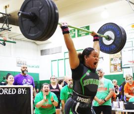 Suwannee’s Kaly Cuffy finishes her clean and jerk during the Power of Christmas meet on Friday. (PAUL BUCHANAN/Special to the Reporter)