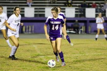 Columbia's Mia Brasel dribbles up the field against Buchholz on Jan. 3. (BRENT KUYKENDALL/Lake City Reporter)