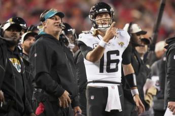 Jacksonville Jaguars quarterback Trevor Lawrence speaks with Jacksonville Jaguars head coach Doug Pederson during Saturday's divisional round playoff game against the Kansas City Chiefs in Kansas City, Mo. (CHARLIE RIEDEL/Associated Press)