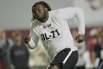 Oklahoma offensive lineman Anton Harrison participates in a drill during his pro day on March 30 in Norman, Okla. (SUE OGROCKI/Associated Press)