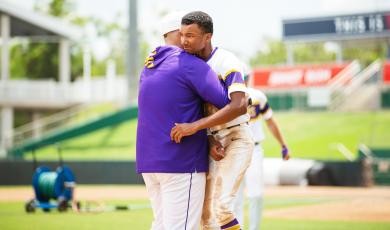 Columbia assistant coach Tracy Brinkley (left) hugs shortstop Brayden Thomas following the Tigers’ 5-2 loss to American Heritage in the Class 5A state semifinals on Monday at Hammond Stadium in Fort Myers. (JESSICA PILAND/Special to the Reporter)