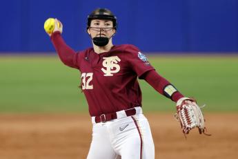 Florida State's Kathryn Sandercock pitches against Washington during a Women's College World Series game on Saturday in Oklahoma City. (NATE BILLINGS/Associated Press)