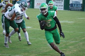 Suwannee receiver MJ Rossin runs up the field for a touchdown against Flagler Palm Coast on Friday night. (JAMIE WACHTER/Lake City Reporter)