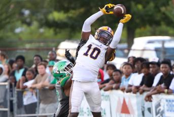Columbia receiver Zamarion Jones jumps to catch a touchdown pass in the back of the end zone against Suwannee during Friday’s Preseason Classic. (BRENT KUYKENDALL/Lake City Reporter)