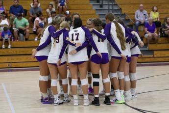 Columbia huddles prior to a tri-match against Branford and Valdosta on Aug. 22. (BRENT KUYKENDALL/Lake City Reporter)