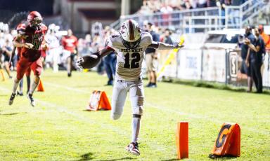 Fort White wide receiver Najeeb Smith celebrates as he crosses the goal line for a touchdown Friday night against Lafayette. (JACK HOWDESHELL/Special to the Reporter)