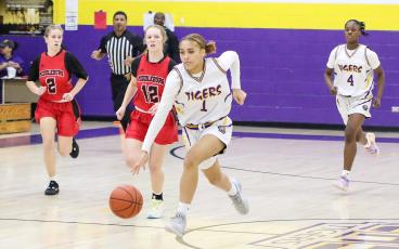 Columbia guard Mariah Cox dribbles up the court in transition after a steal against Middleburg in the District 2-5A quarterfinals on Monday night. (BRENT KUYKENDALL/Lake City Reporter)