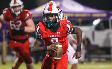 Fort White quarterback Jayden Jackson scrambles up the field against Union County during the Region 3-1A semifinals last season. (BRENT KUYKENDALL/Lake City Reporter)