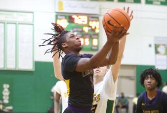 Columbia guard Zamarion Jones rises to shoot against Suwannee on Tuesday night. (PAUL BUCHANAN/Special to the Reporter)