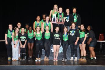 Suwannee's girls weightlifting team celebrates after winning the Region 1-1A titles in traditional and Olympic on Saturday. (PAUL BUCHANAN/Special to the Reporter)